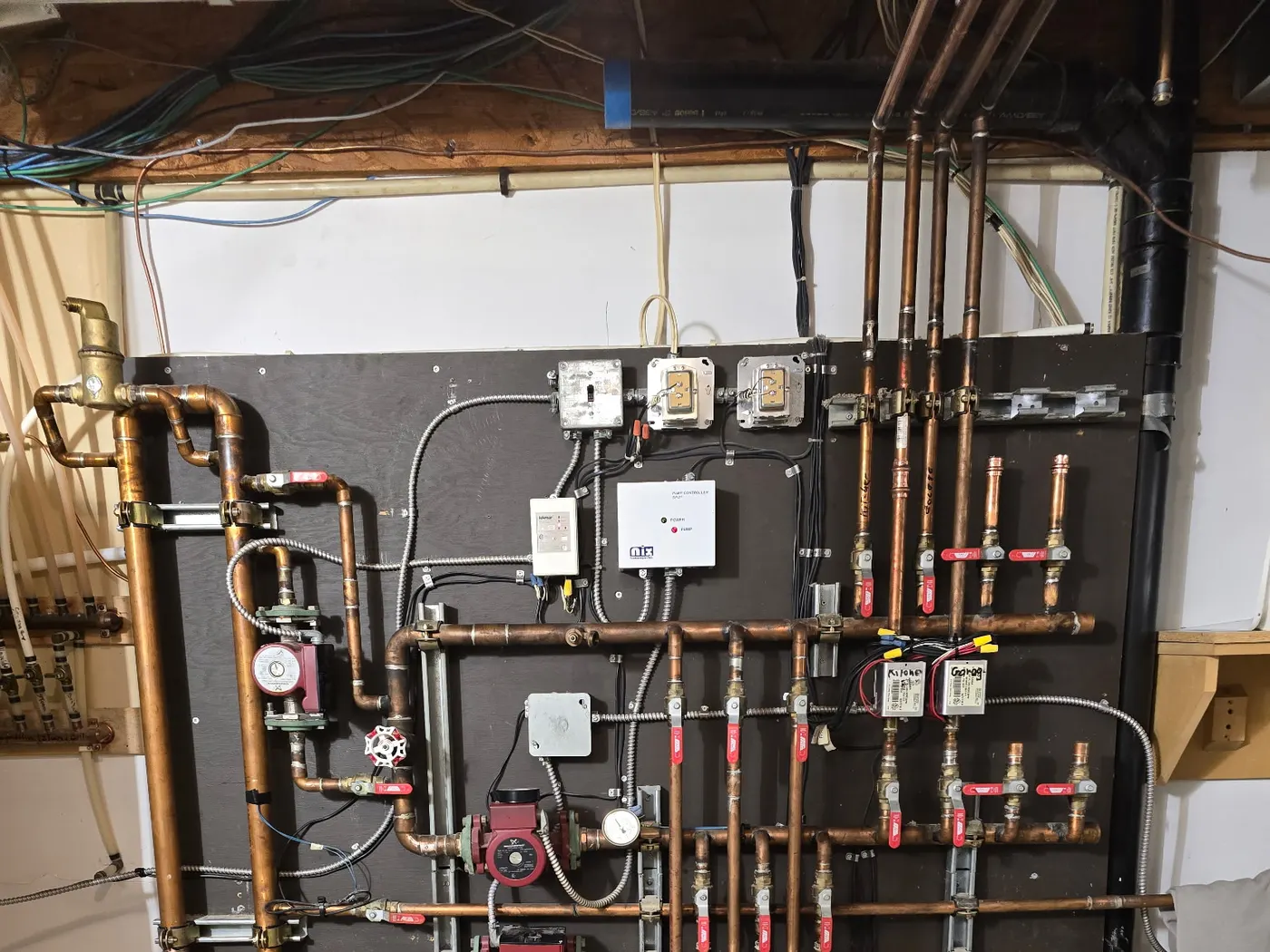 Copper hydronic manifold board built by Rhino Plumbing