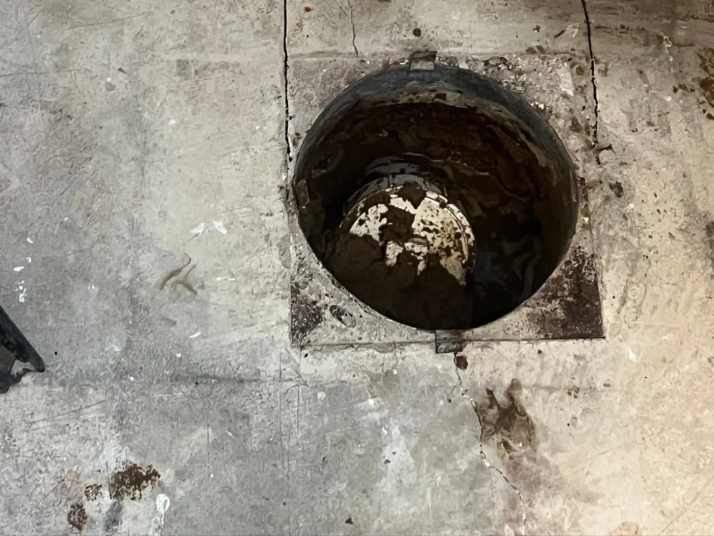 Sump pit cut into a basement concrete floor